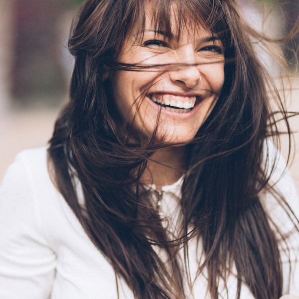 woman smiling on windy day